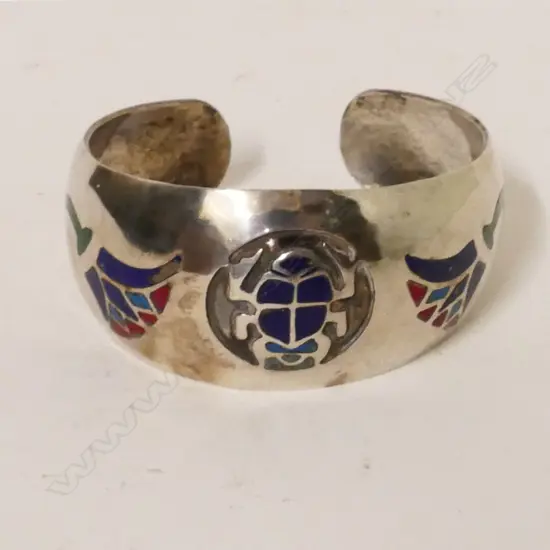 A silver Egyptian cuff bracelet