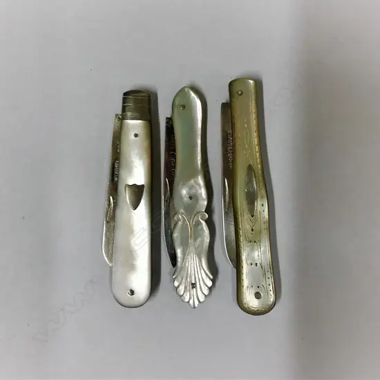 Three silver and mother-of-pearl folding fruit knives
