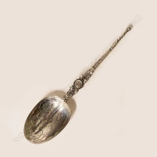 A silver anointing spoon