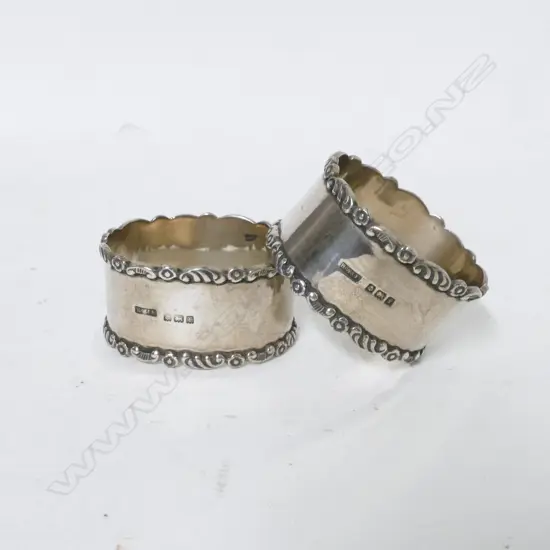 A pair of Edwardian silver napkin rings