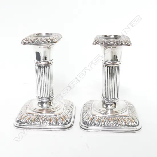 A pair of small Victorian silver plate on copper column candlesticks