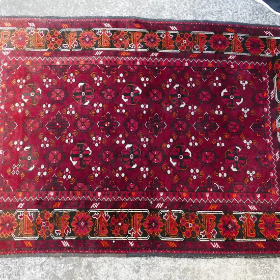 A hand knotted Baluchi rug