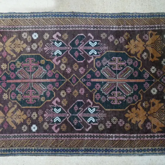 A small hand knotted Baluchi rug