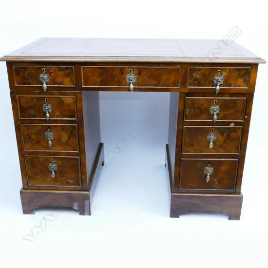 A Victorian walnut twin pedestal desk