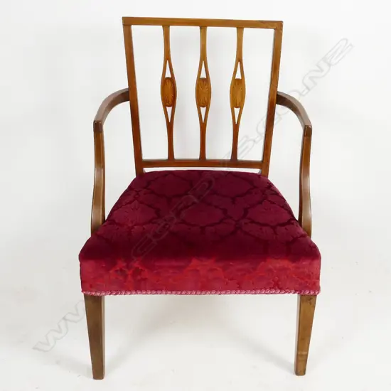 An Edwardian mahogany Sheraton Revival elbow chair