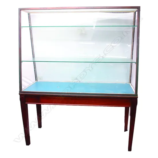 A vintage bronze framed museum display cabinet on original mahogany stand